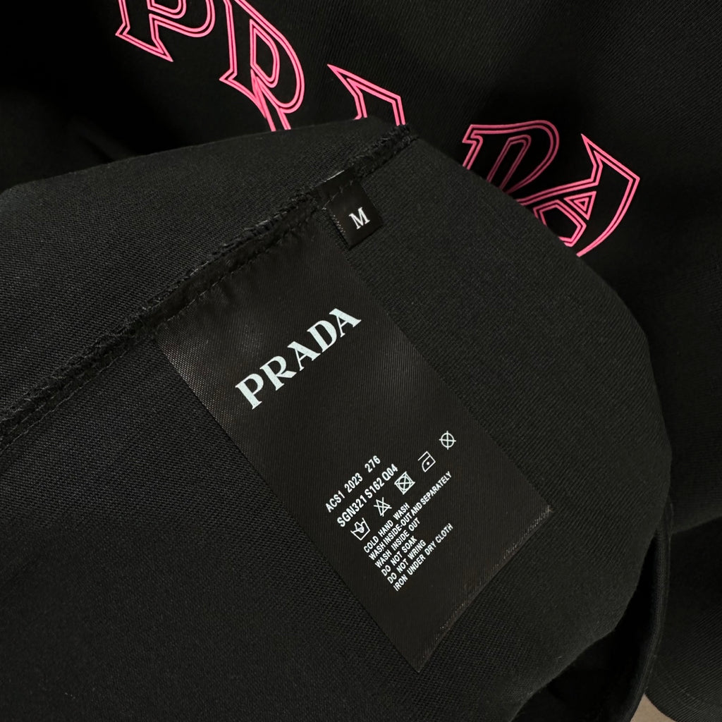 Prada T-shirt care label on black fabric, size M