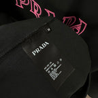 Prada T-shirt care label on black fabric, size M
