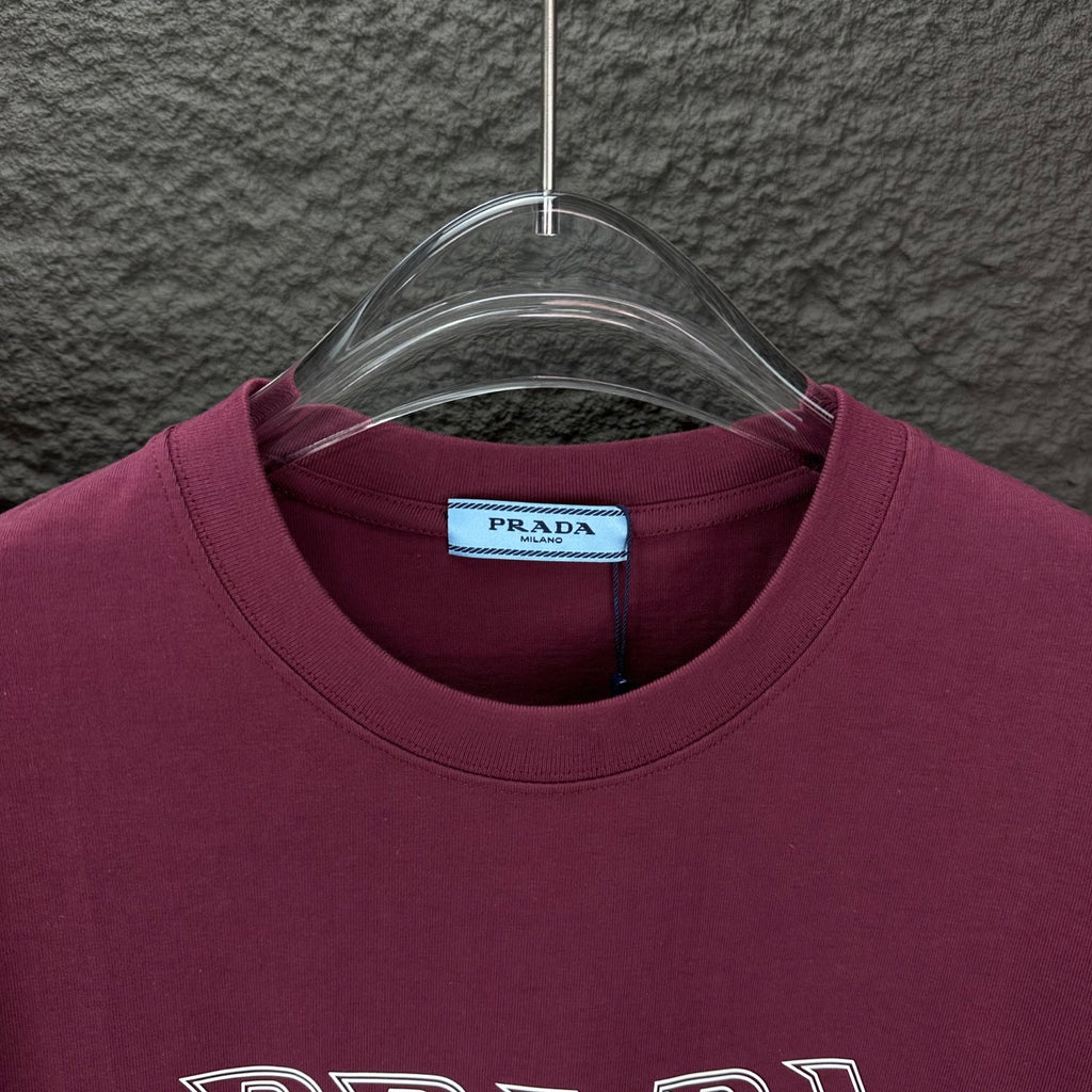 Burgundy crewneck T-shirt with Prada neck label and ribbed collar