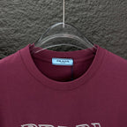 Burgundy crewneck T-shirt with Prada neck label and ribbed collar