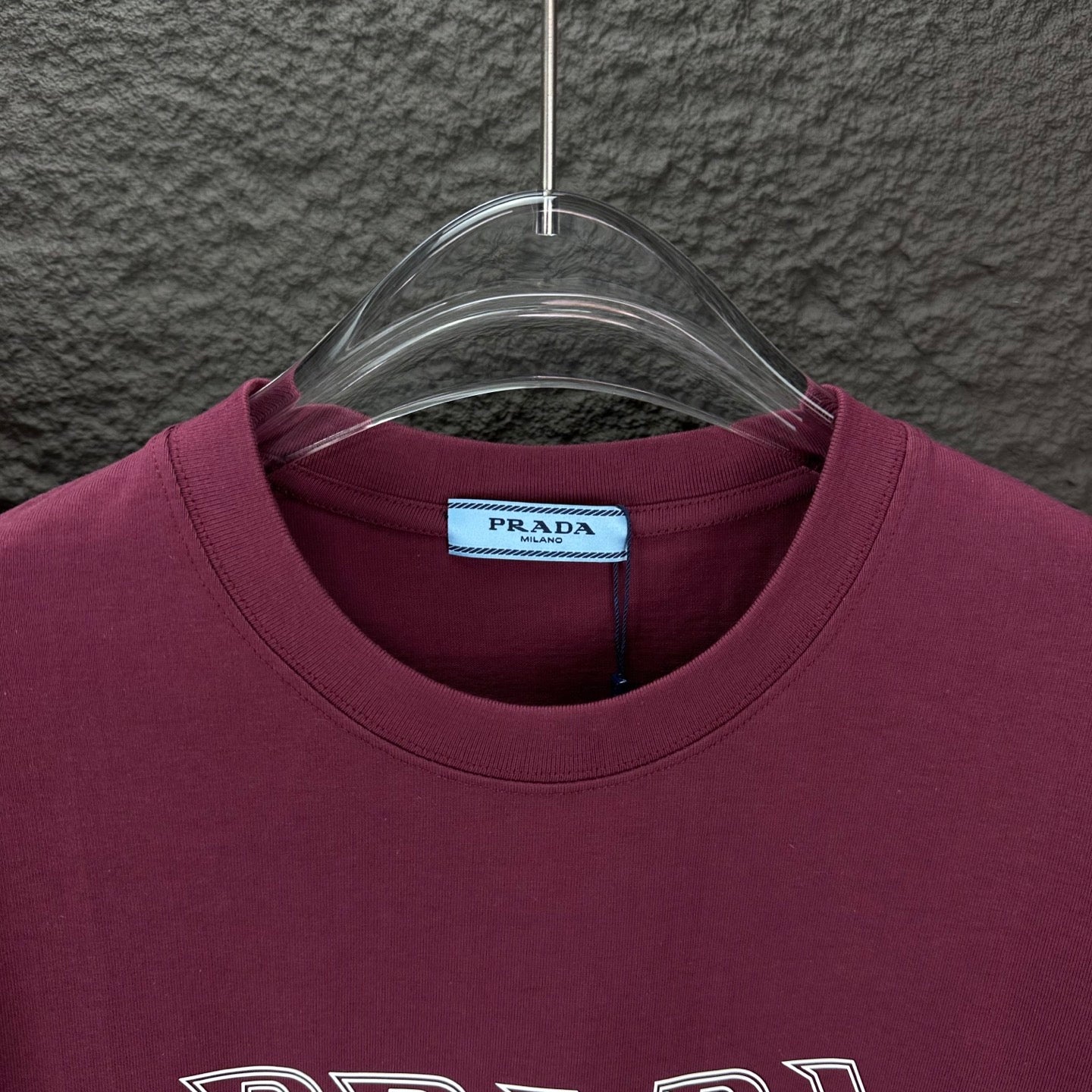 Burgundy crewneck T-shirt with Prada neck label and ribbed collar