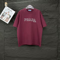 Burgundy crewneck Prada T-shirt with PRADA MIL ANO chest logo