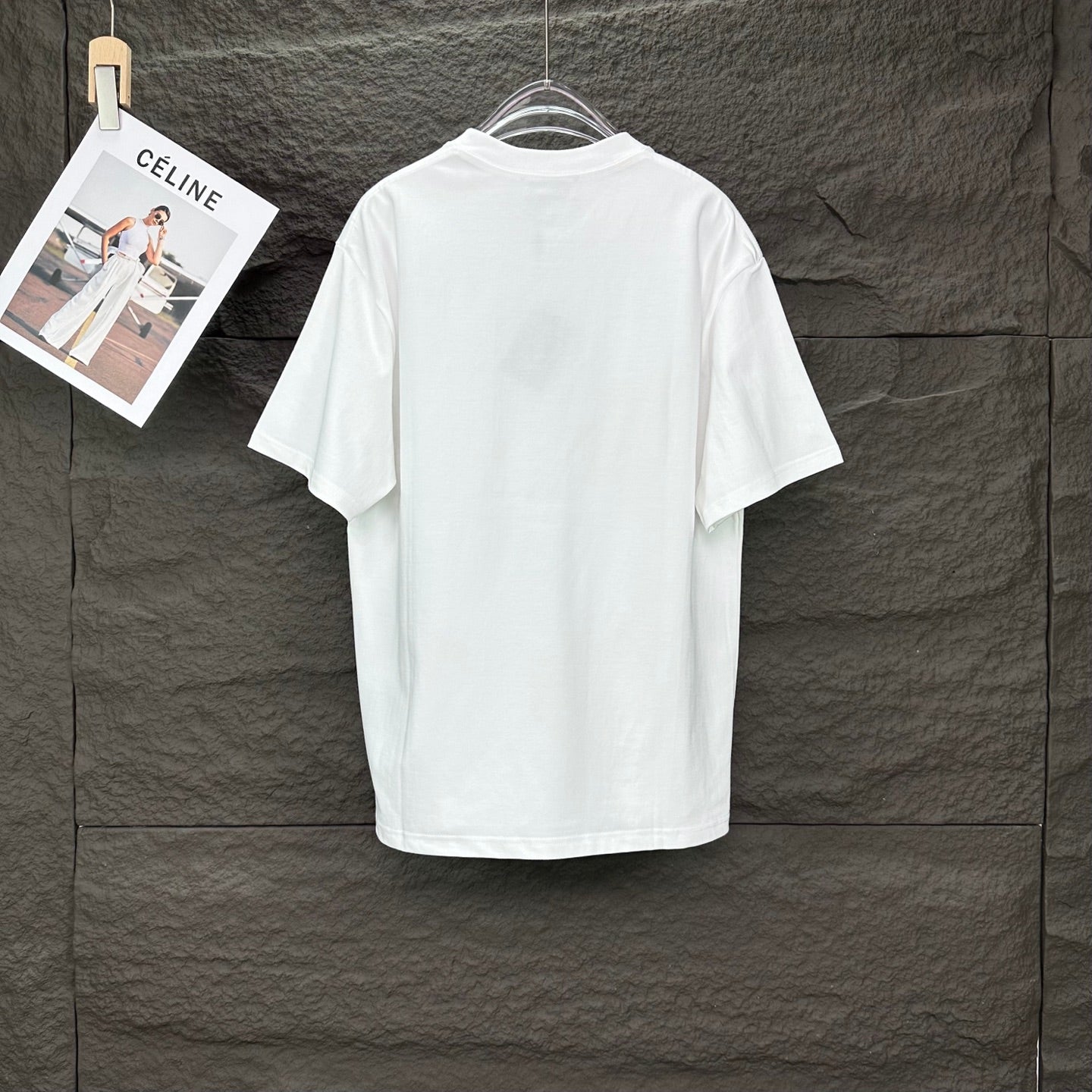 White short-sleeve T-shirt with crew neck; plain back view on a hanger.
