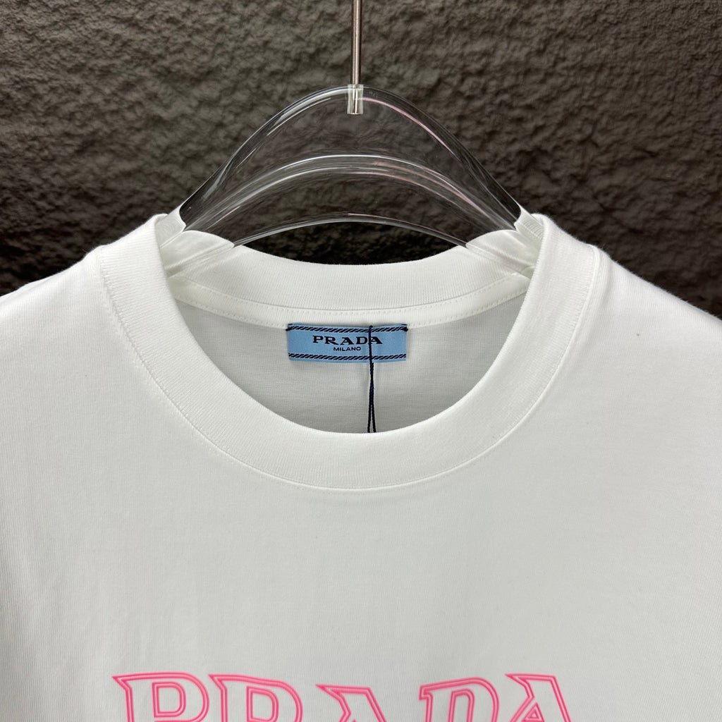 White crew-neck T-shirt with PRADA MIL ANO label at the neckline.