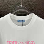 White crew-neck T-shirt with PRADA MIL ANO label at the neckline.