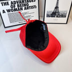 Red cap interior view with black lining and hanging red drawstring.