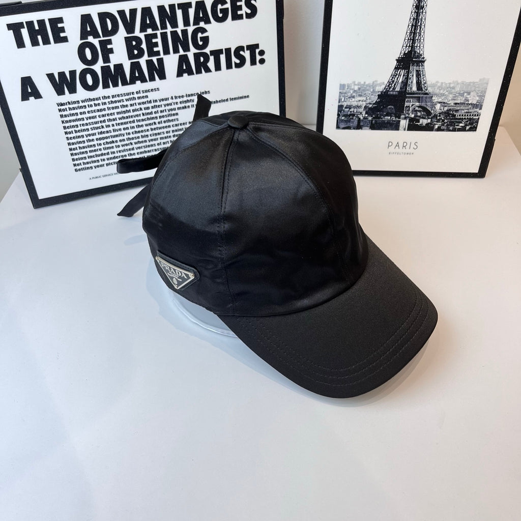 Prada cap in dark gray with embroidered triangular PRADA logo patch.
