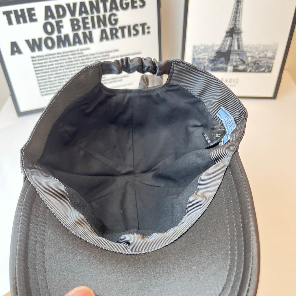 Prada cap interior with striped trim and blue brand label inside front.