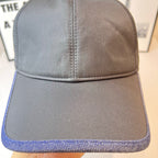 Navy Prada baseball cap with stitched center seam and blue contrast brim edge detail.
