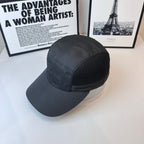 Dark baseball cap with mesh side panel and curved brim.