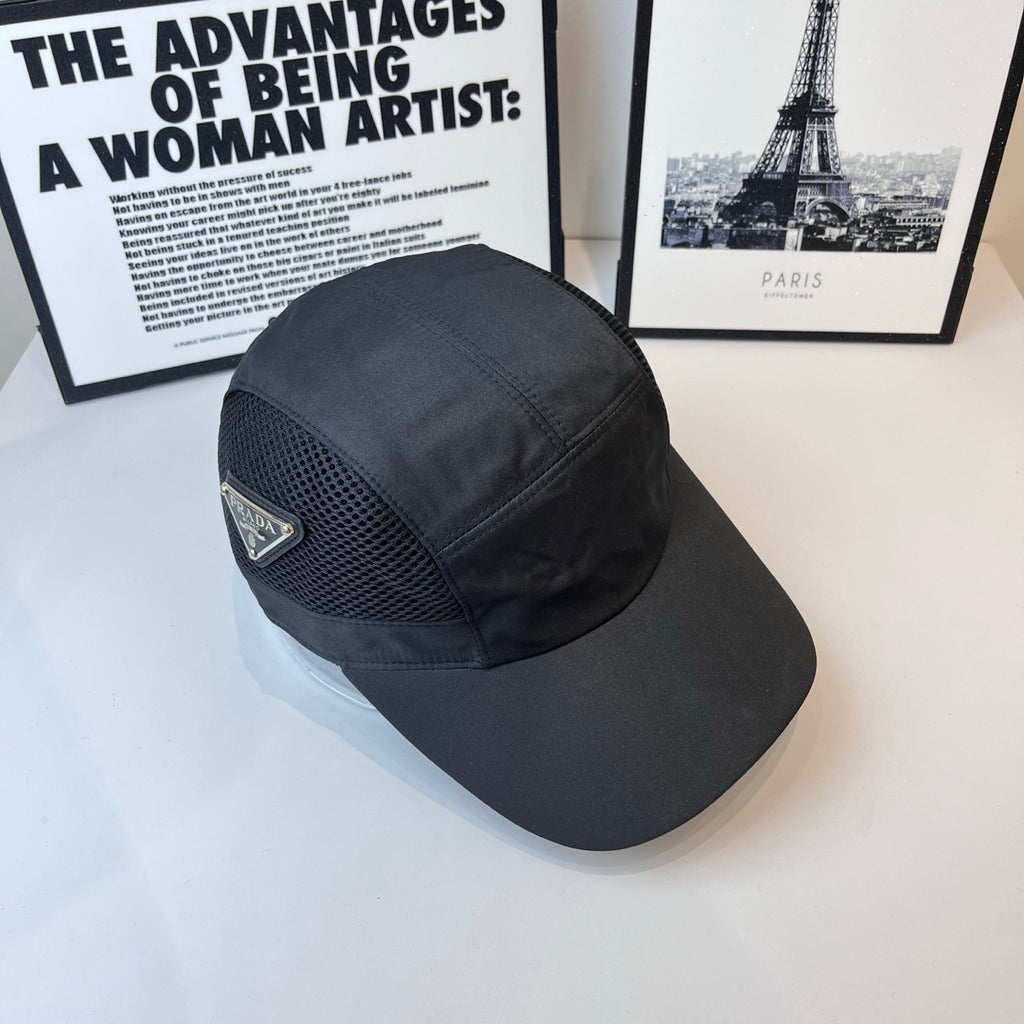Dark baseball cap with mesh crown and Prada triangular logo on front.