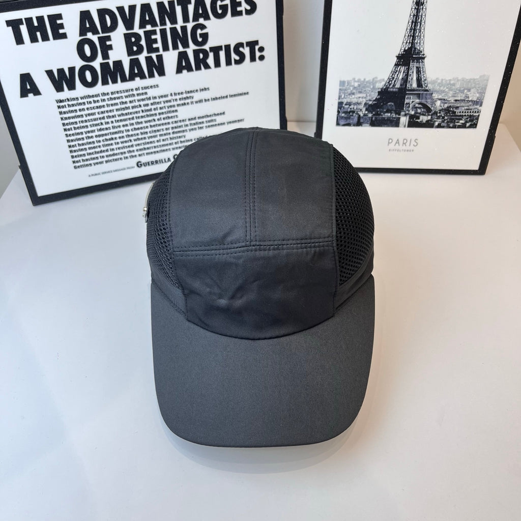 Dark baseball cap with mesh crown and stitched front panel, metal logo detail.