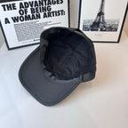 Prada baseball cap back view with interior lining and curved brim in dark gray
