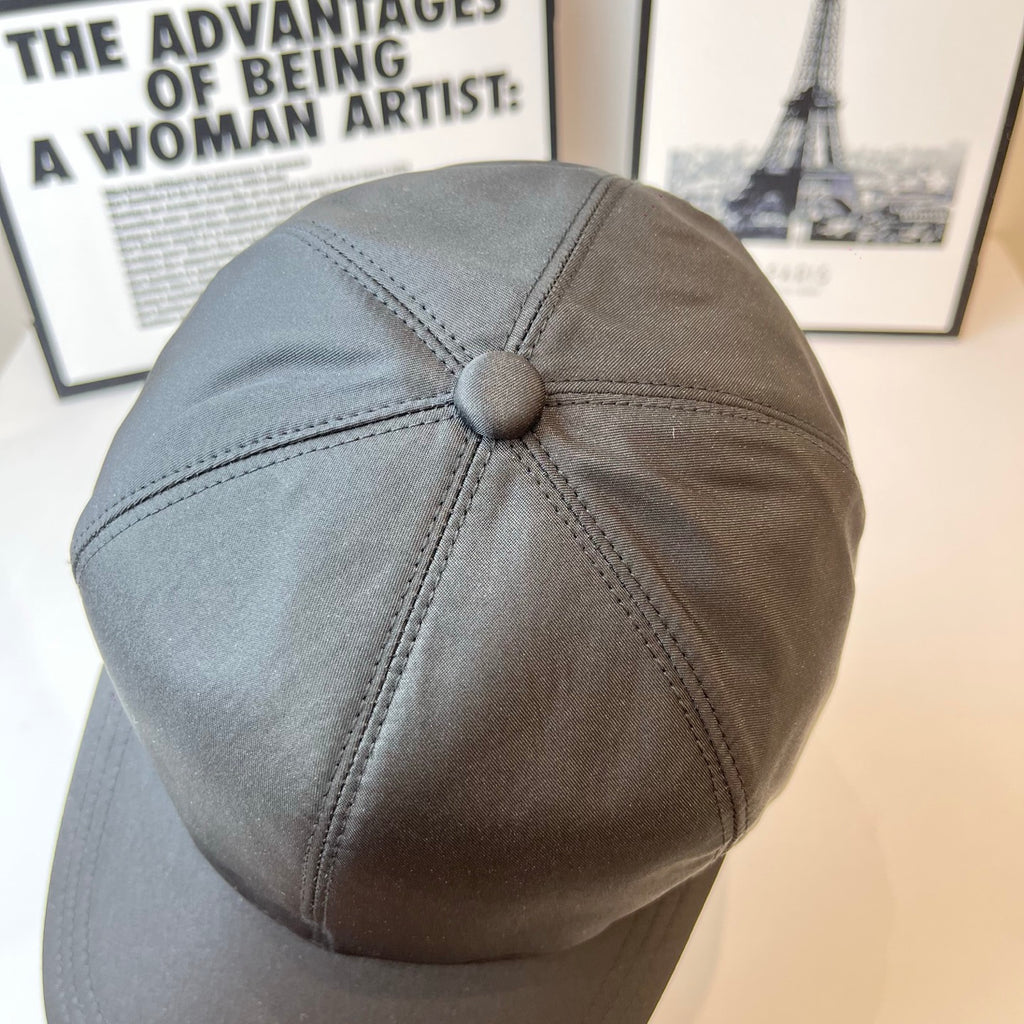 Prada baseball cap with crown button and curved brim in dark gray