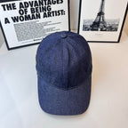 Prada denim cap in dark blue, curved brim and stitched crown with top button.