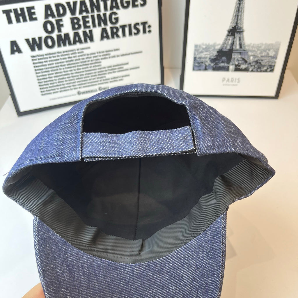 Prada denim cap interior view, black lining with front panel stitching.