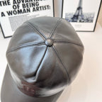 Dark leather baseball cap with back button detail and stitched crown paneling