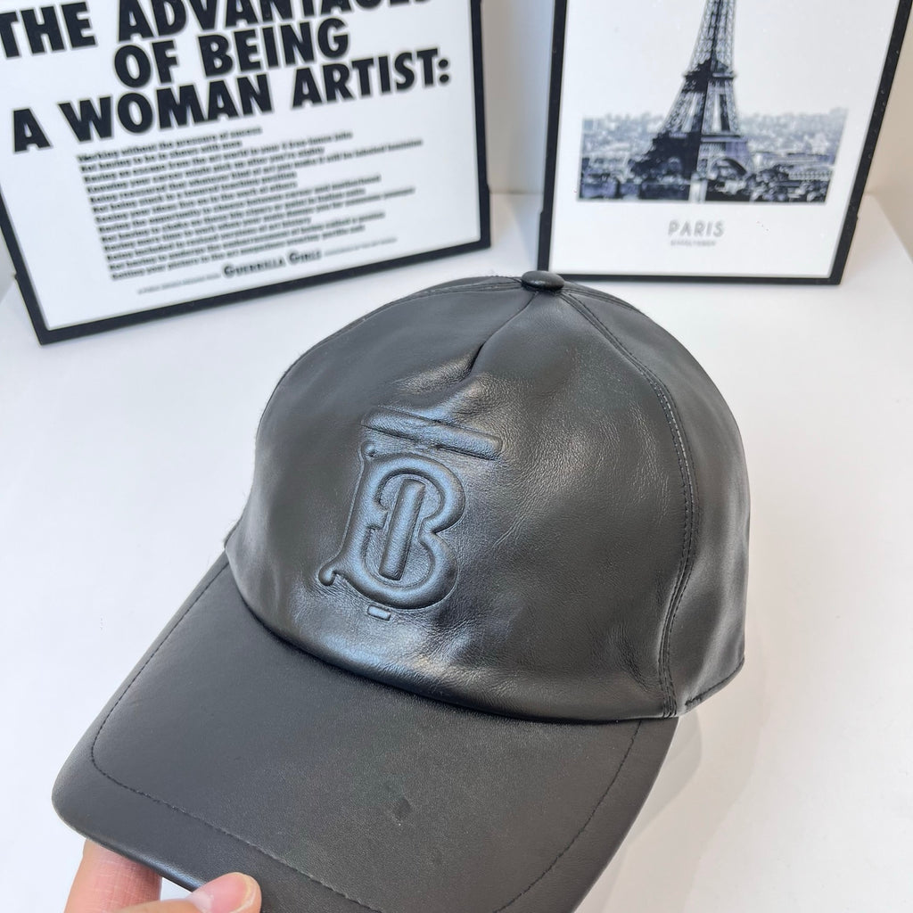 Dark leather baseball cap with embossed Burberry TB logo, curved brim
