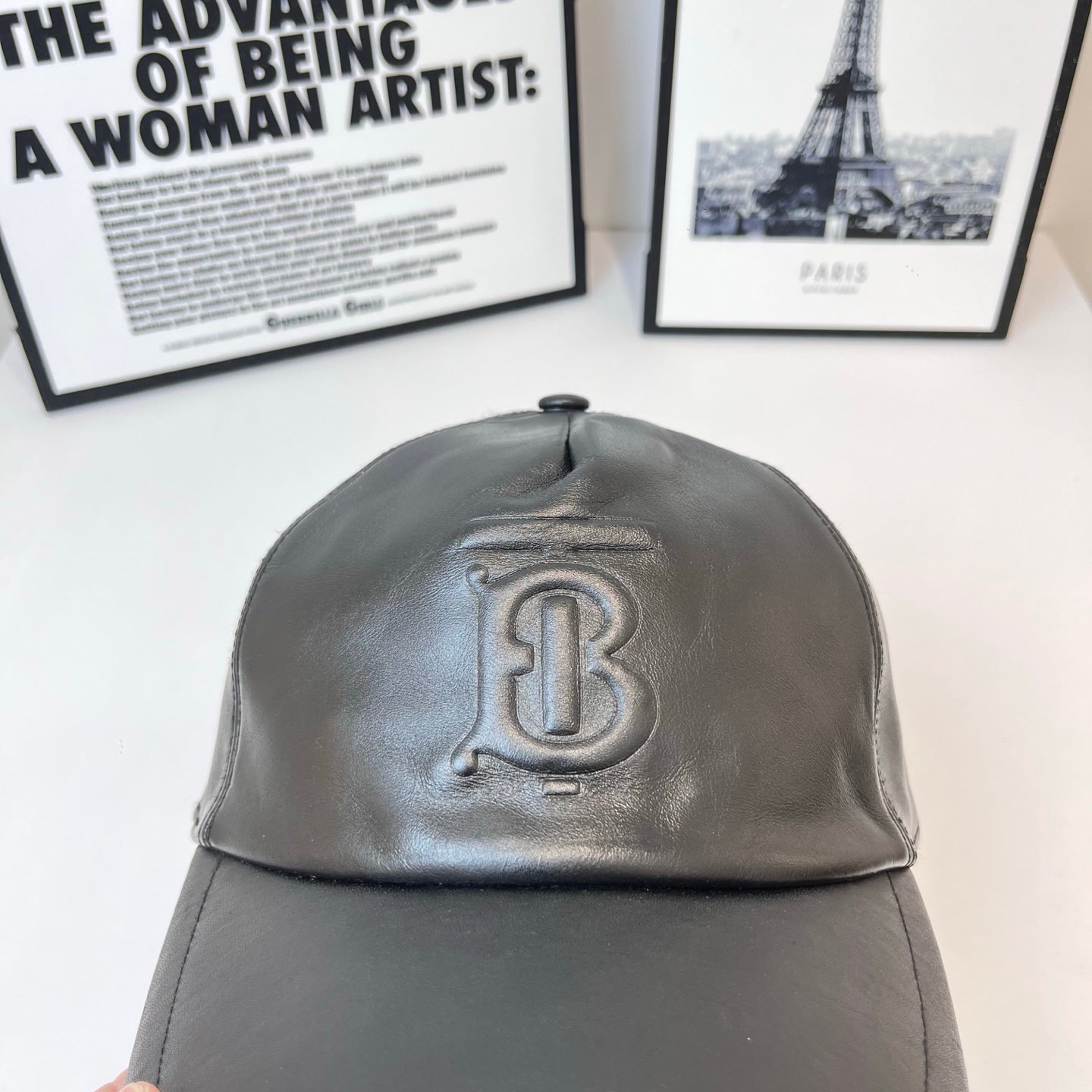 Dark leather baseball cap with embossed Burberry TB logo, domed crown