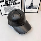 Dark leather baseball cap with stitched crown panels and curved brim