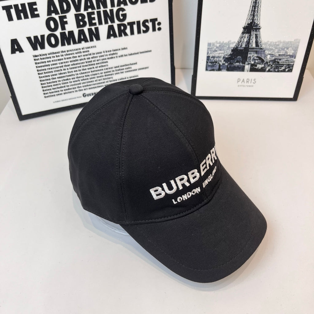 Black Burberry baseball cap angled view with embroidered "BURBERRY" and "LONDON ENGLAND".