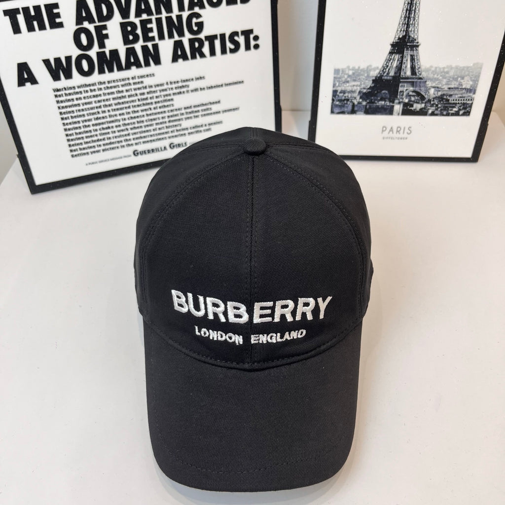 Black Burberry baseball cap with front logo and "LONDON ENGLAND" text.