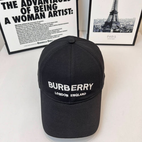 Black Burberry baseball cap with front logo and "LONDON ENGLAND" text.