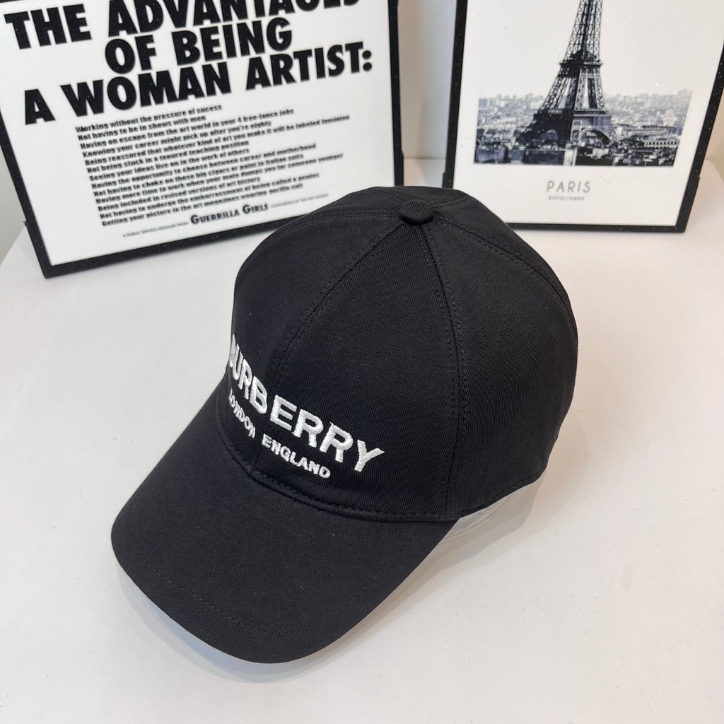Black Burberry cap with side embroidered logo and "LONDON ENGLAND" text.
