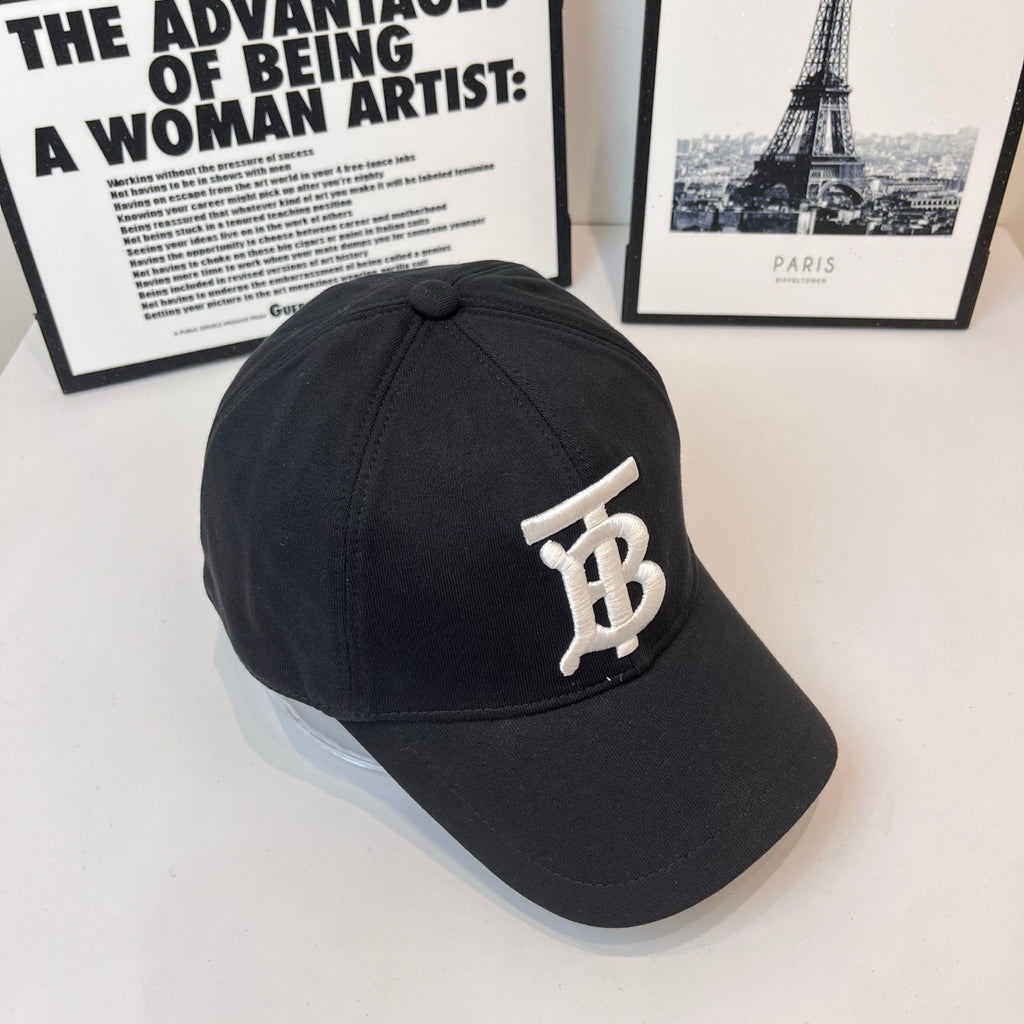 Black Burberry cap side view with white TB monogram badge
