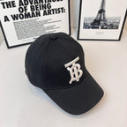 Black Burberry cap side view with white TB monogram badge