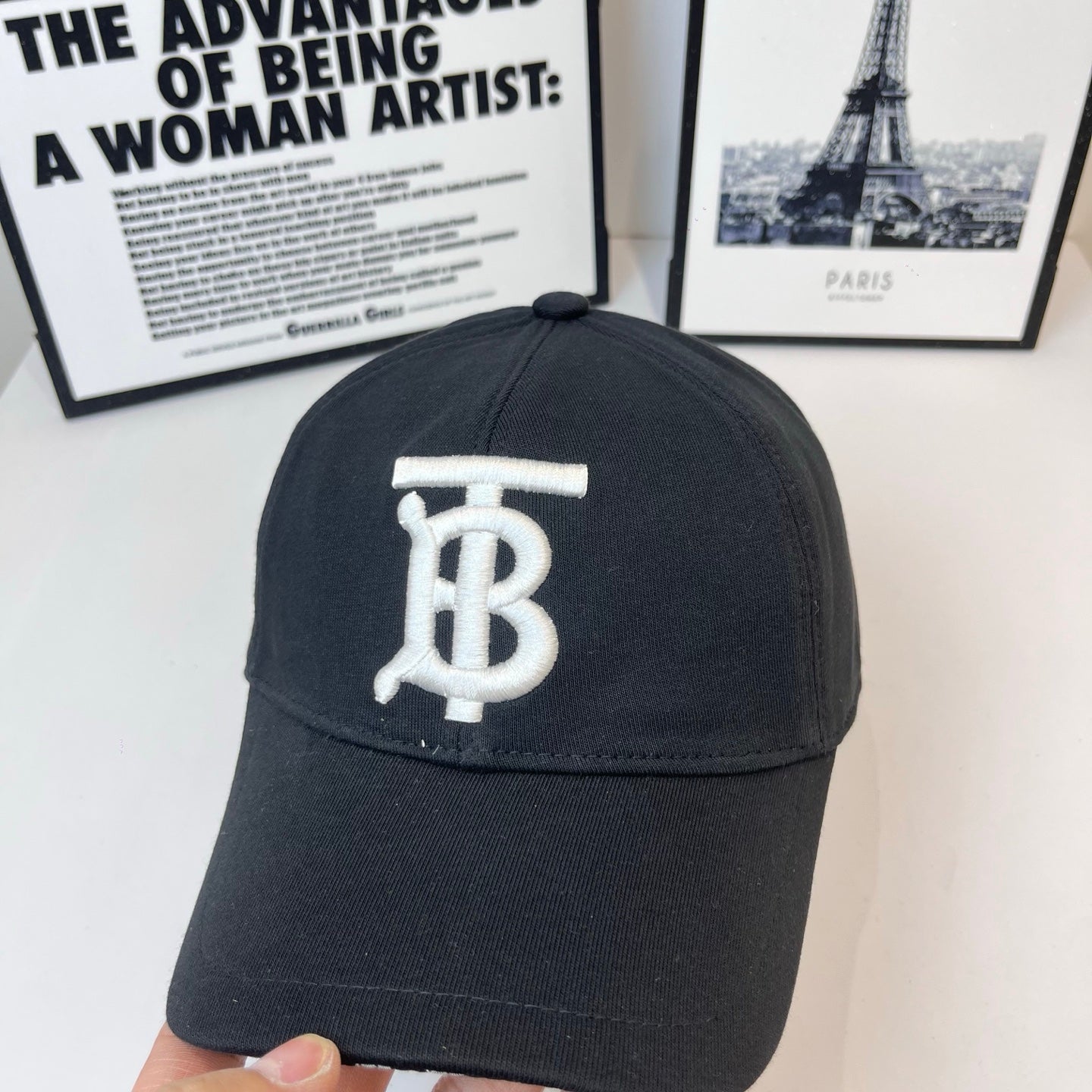 Black Burberry cap front view with embroidered TB monogram