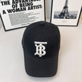 Black Burberry cap with white TB monogram on the front