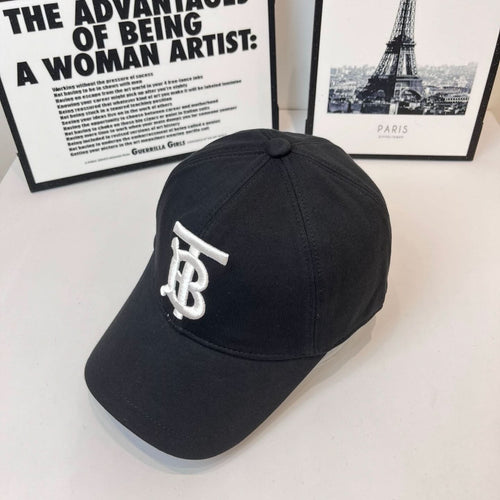 Dark Burberry cap angled view with white TB logo patch