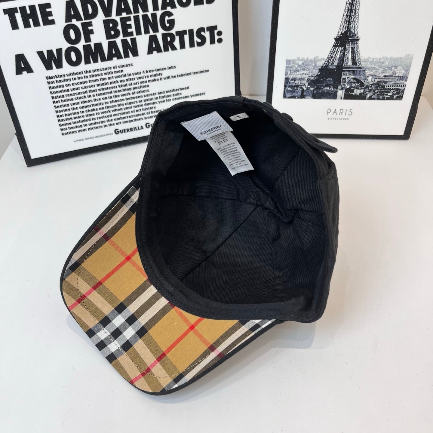 Dark Burberry cap interior view with stitched seams and inner lining