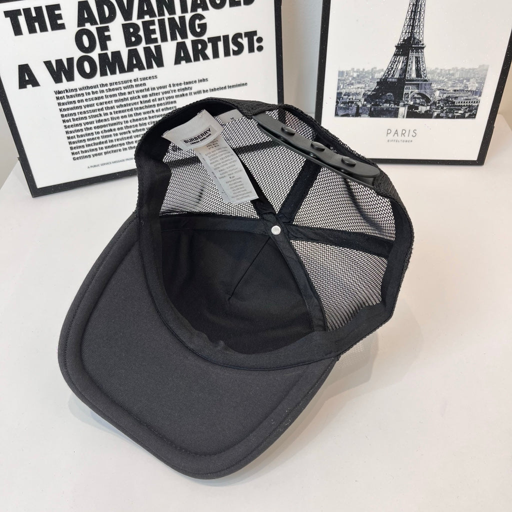 Black Burberry cap with mesh back, curved brim, and side tag attached