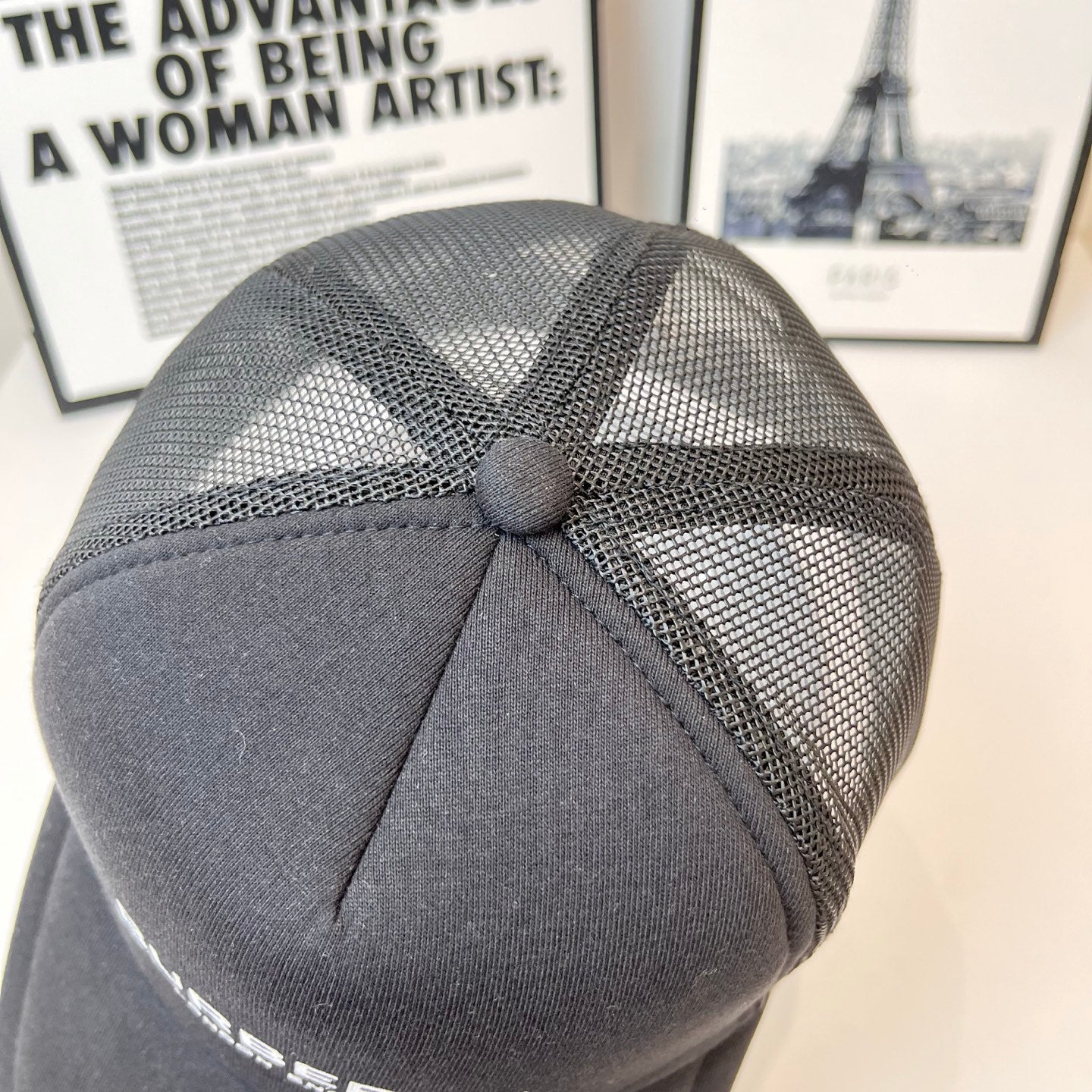 Black Burberry mesh cap top view with stitched crown panel and button