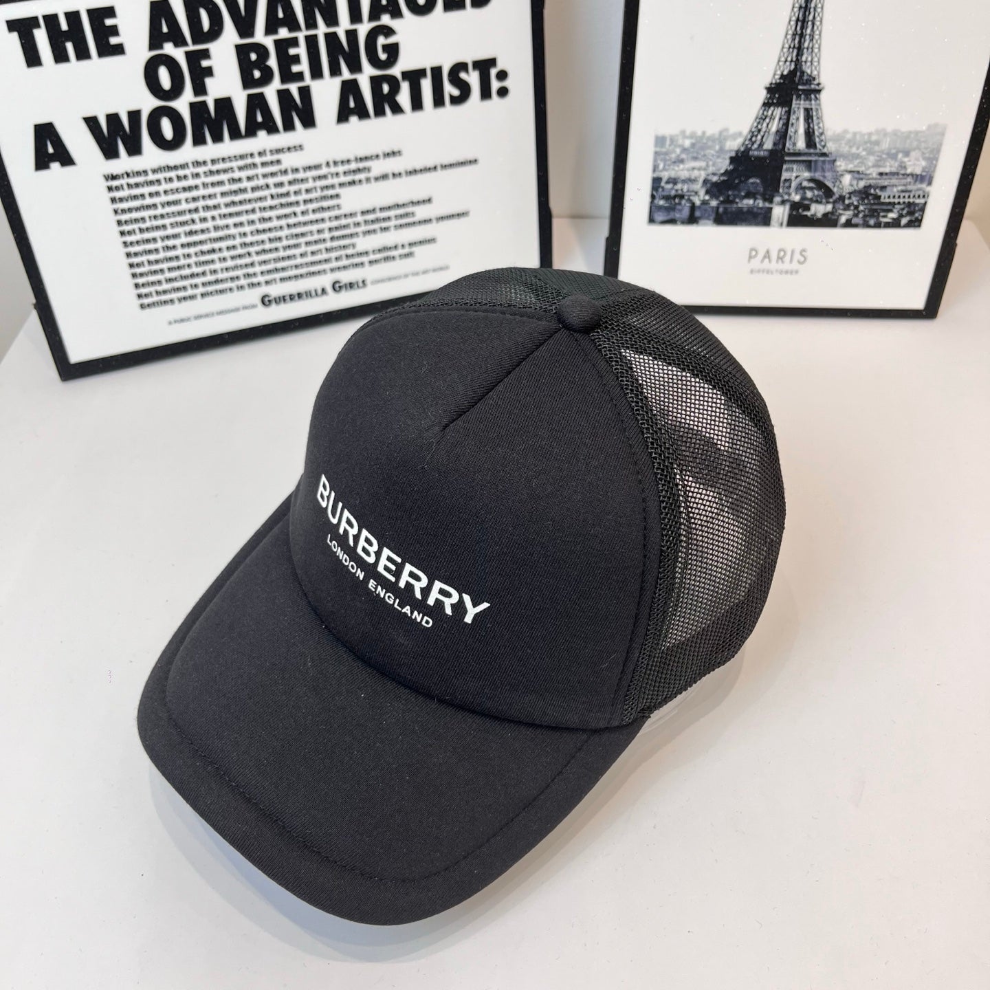 Black Burberry baseball cap with mesh side panels and front logo