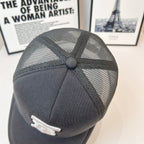 Black mesh-back cap with stitched crown panels and small white logo detail