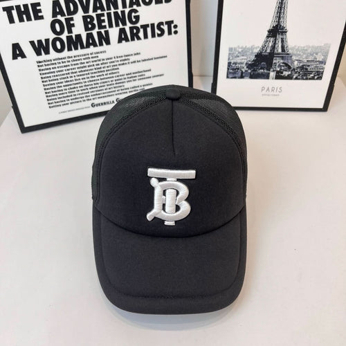 Black baseball cap with white embroidered monogram logo on front and curved brim
