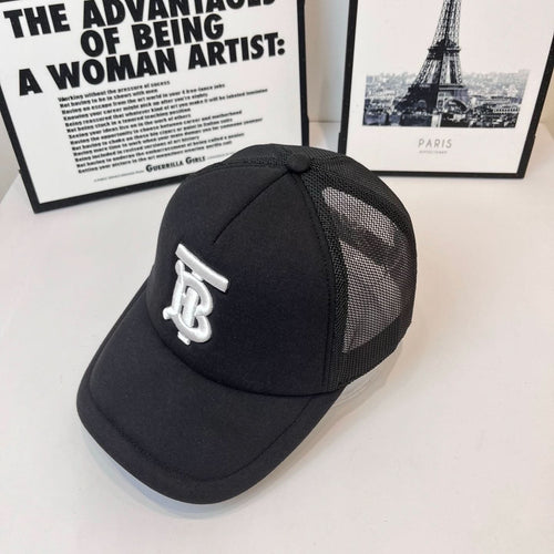 Black baseball cap with white embroidered monogram logo on side and mesh panel