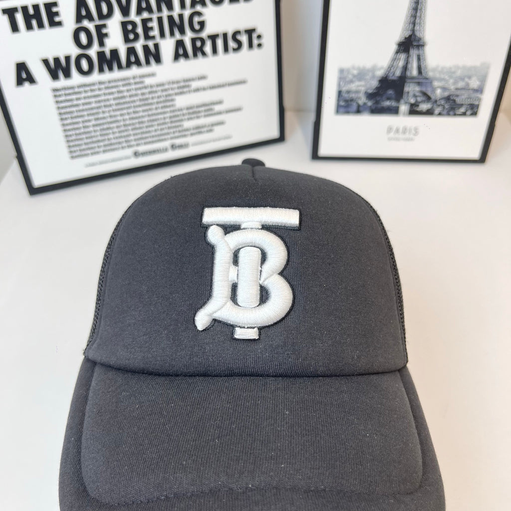 Black baseball cap with large front white monogram logo and curved brim
