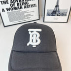 Black baseball cap with large front white monogram logo and curved brim