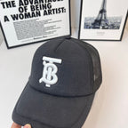 Black baseball cap with front white monogram logo and mesh side panel