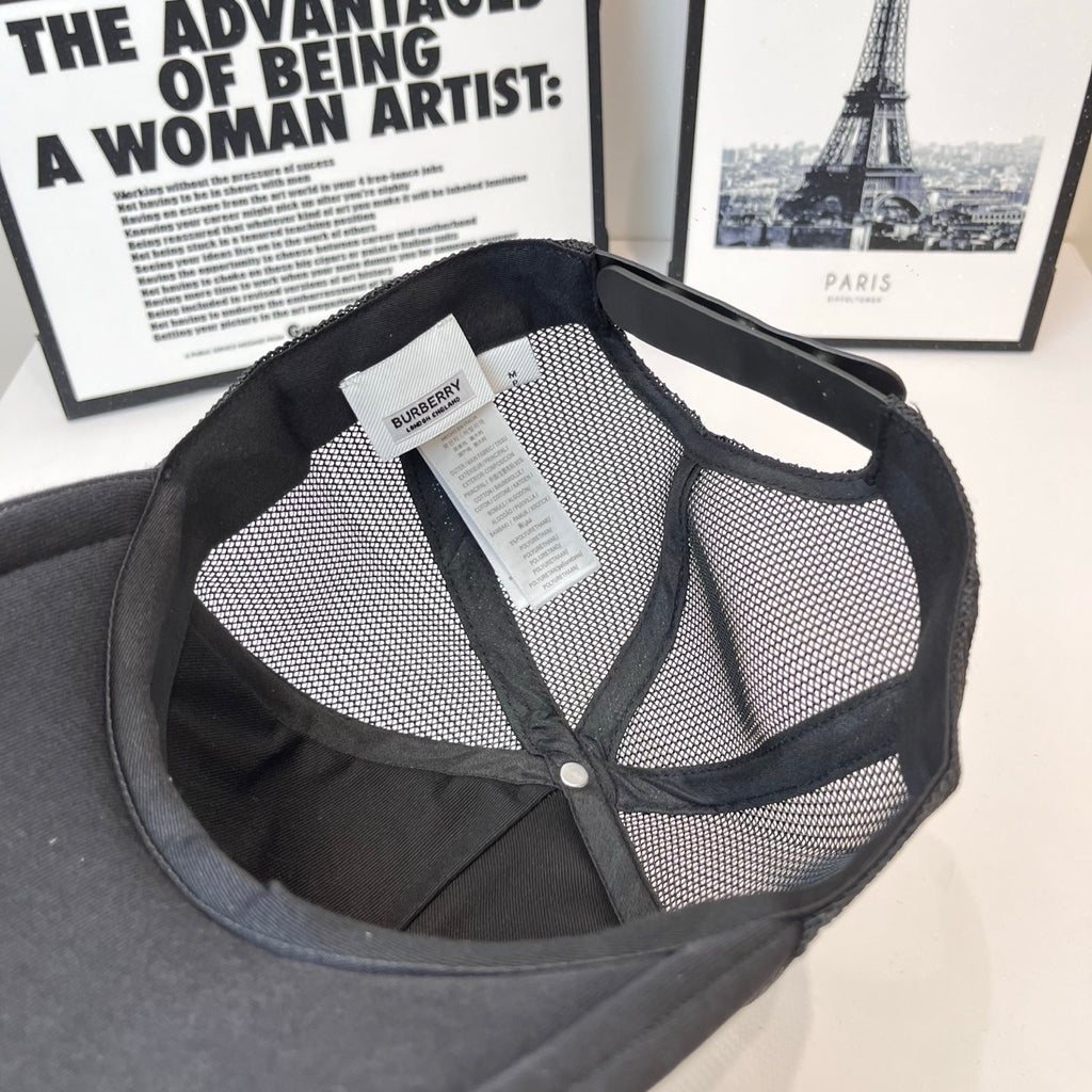 Black mesh-back cap interior with brand tag and buttoned opening near crown