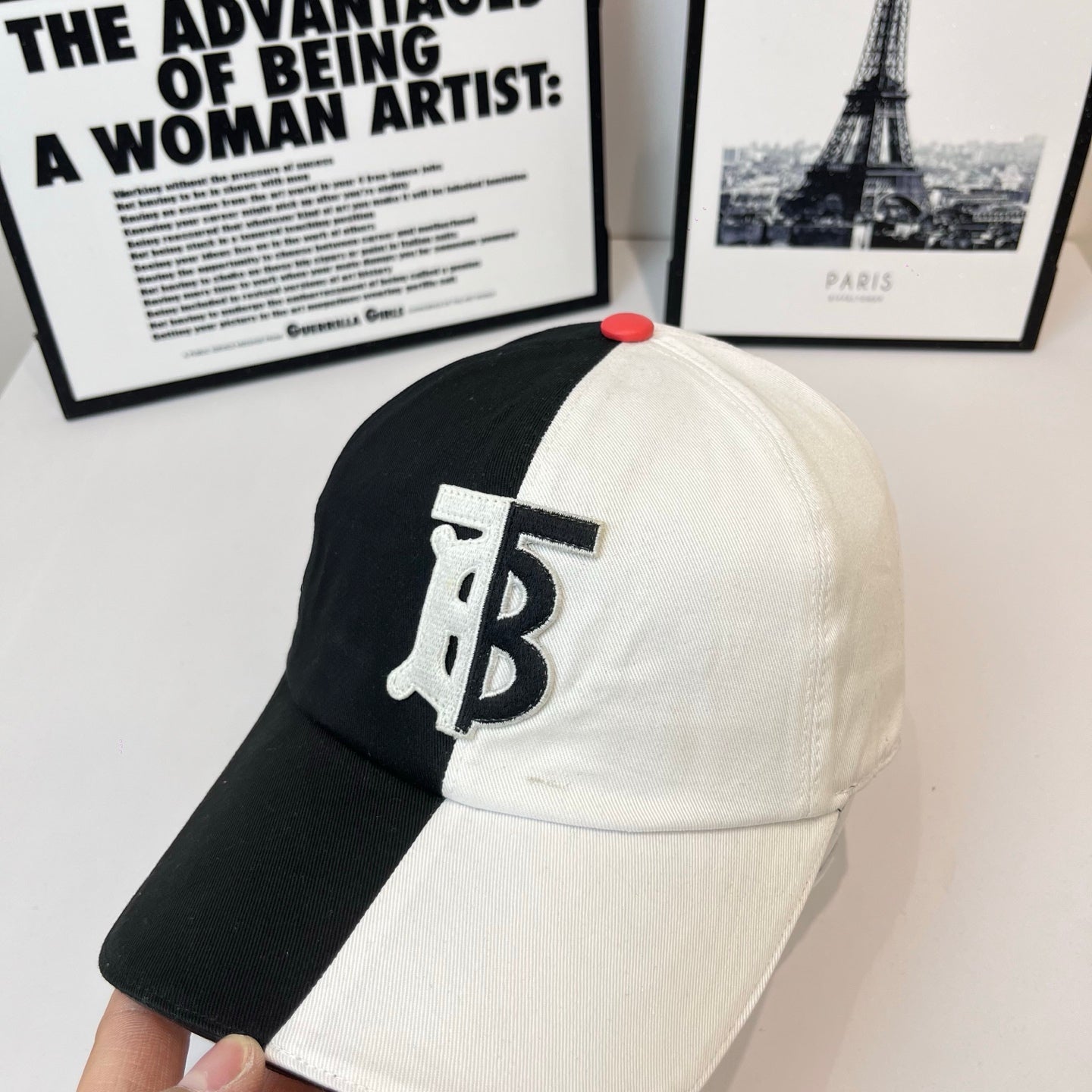 Two-tone Burberry cap with large TB logo on front panels and red top button
