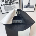 Burberry cap with adjustable snap strap and TB label patch on the interior