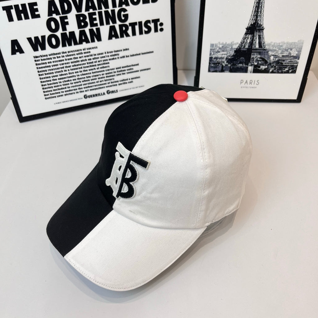 Two-tone Burberry cap with black side, white front, TB monogram and red top button