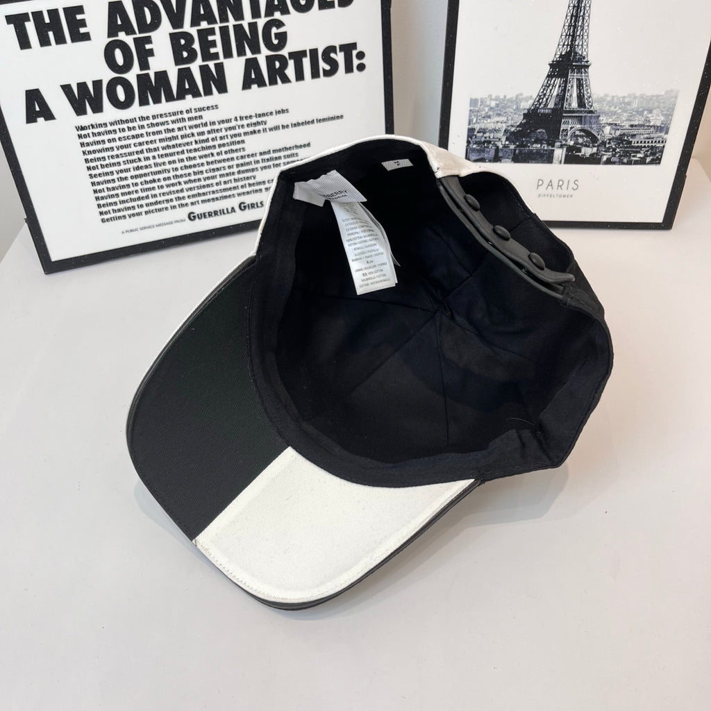 Two-tone Burberry cap back view with black crown, white brim, and hanging tag