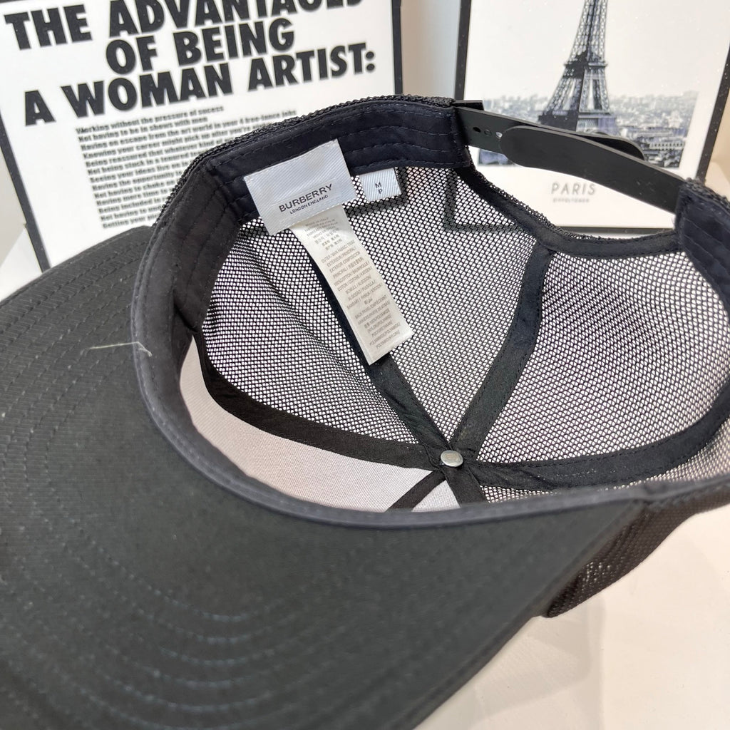 Black mesh baseball cap interior with stitched strap and Burberry label