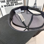 Black mesh baseball cap interior with stitched strap and Burberry label